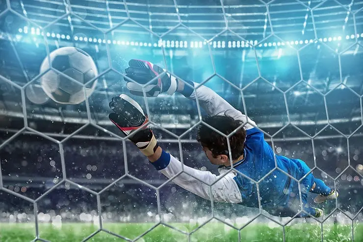 Goalkeeper making a crucial save, illustrating the benefits of 360 degree feedback in identifying hidden talent and performance.